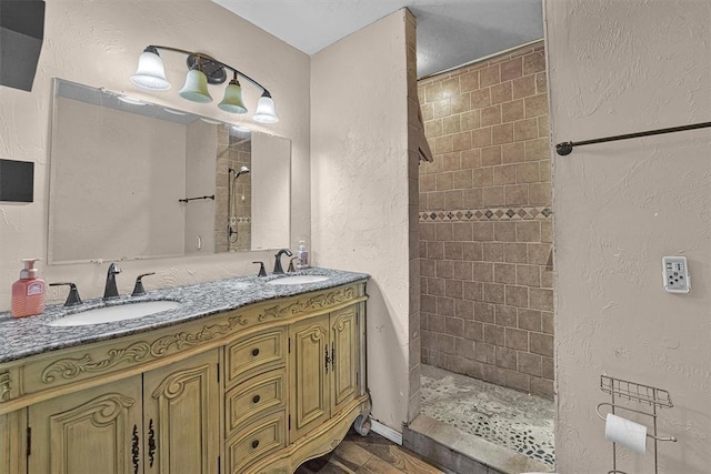 11402 N 1957th Rd, Elk City, OK 73644 - full bath with tiled shower, a textured wall, and double vanity