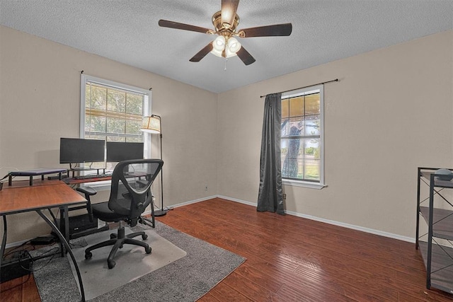 11402 N 1957th Rd, Elk City, OK 73644 - office space featuring wood finished floors, a ceiling fan, a textured ceiling, and baseboards