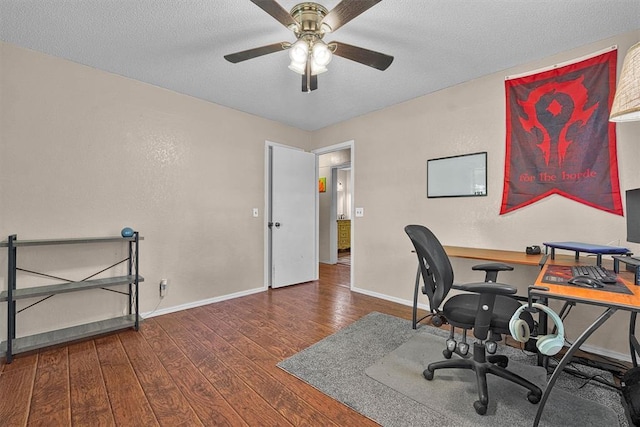 11402 N 1957th Rd, Elk City, OK 73644 - office space with baseboards, wood finished floors, a ceiling fan, and a textured ceiling