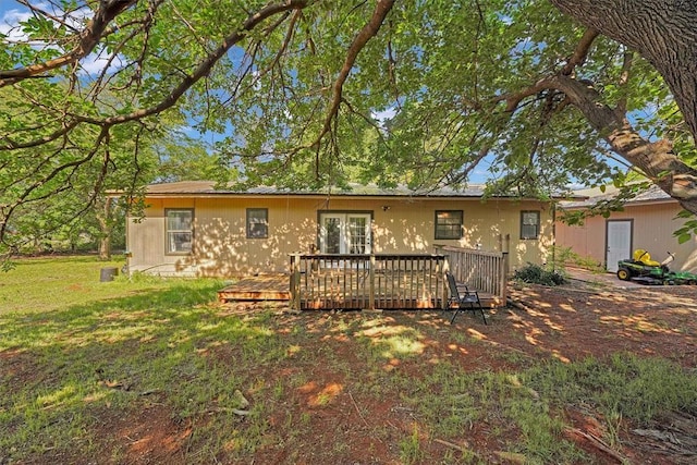 11402 N 1957th Rd, Elk City, OK 73644 - rear view of property with a wooden deck, french doors, and a yard
