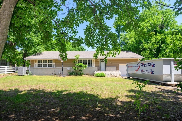 view of front of home with a garage and brick siding