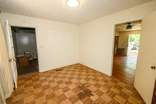 unfurnished room with ceiling fan