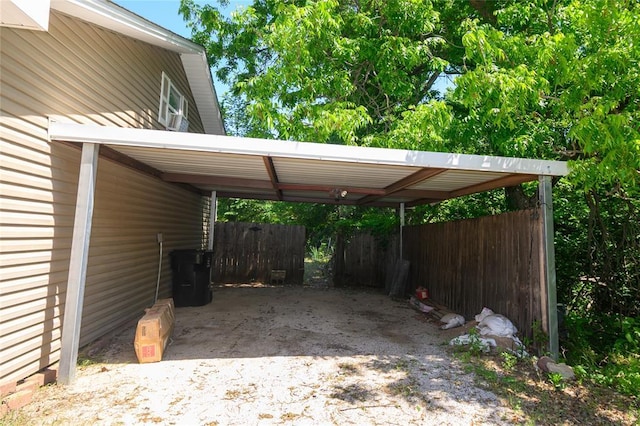 view of car parking featuring fence