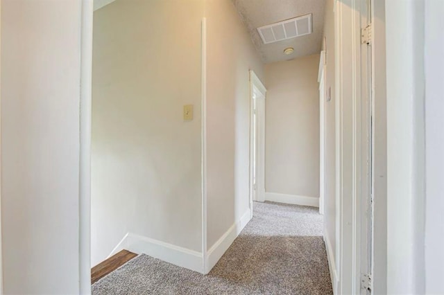 312 S Ash St, Guthrie, OK 73044 - hallway with carpet floors and baseboards