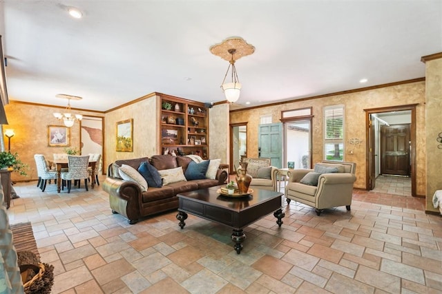 living area featuring stone tile floors, a chandelier, ornamental molding, and recessed lighting