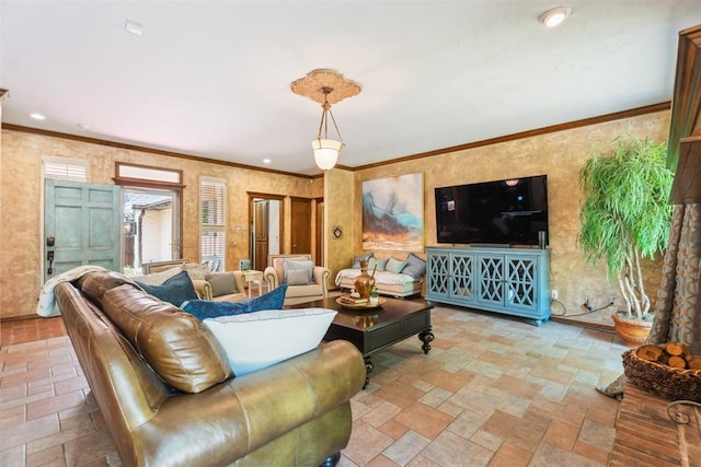 living room featuring stone tile flooring and ornamental molding