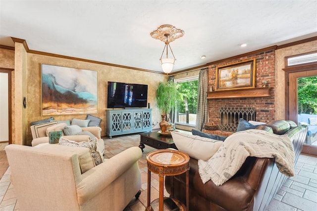 living area with plenty of natural light, stone tile flooring, a brick fireplace, and ornamental molding