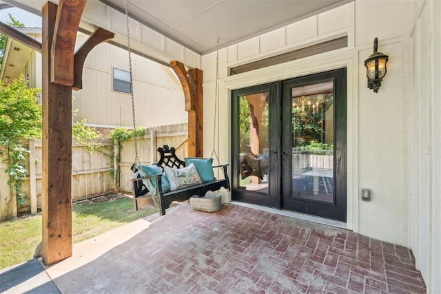 view of patio / terrace with french doors and fence