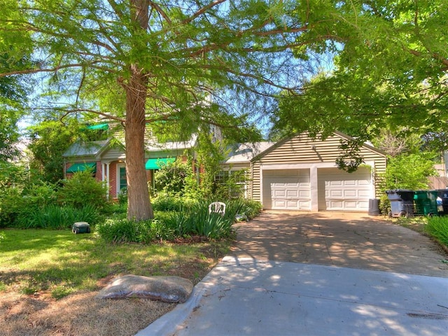 2321 Cashion Pl, Oklahoma City, OK 73112 - view of front of property with a garage and cooling unit