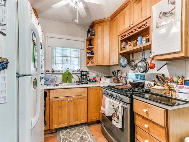 2321 Cashion Pl, Oklahoma City, OK 73112 - kitchen with freestanding refrigerator, gas stove, open shelves, and decorative backsplash