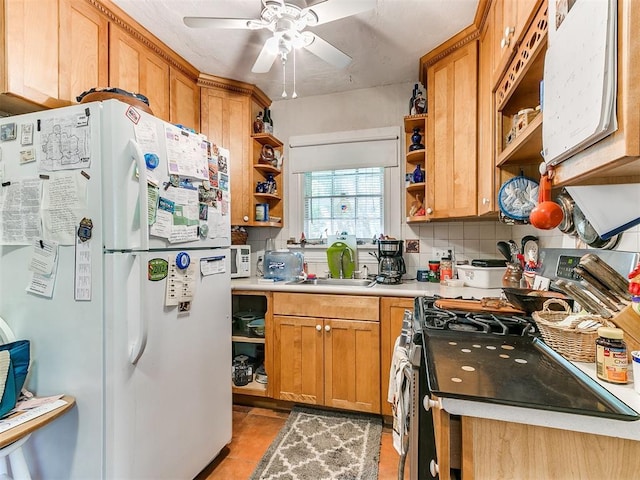 2321 Cashion Pl, Oklahoma City, OK 73112 - kitchen featuring freestanding refrigerator, open shelves, a sink, stainless steel range with gas cooktop, and light countertops
