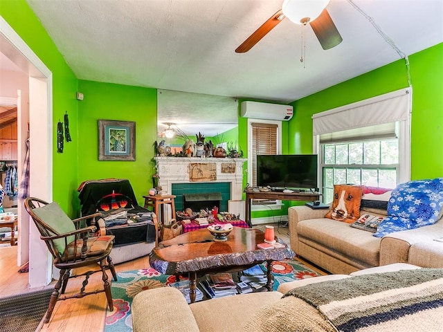 2321 Cashion Pl, Oklahoma City, OK 73112 - living area with an AC wall unit, wood finished floors, ceiling fan, and a fireplace