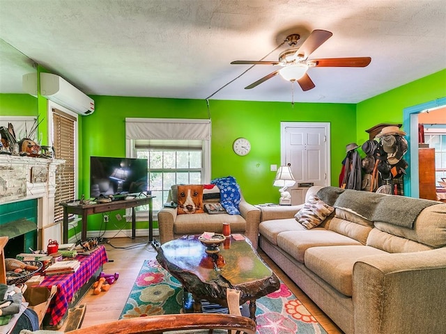 2321 Cashion Pl, Oklahoma City, OK 73112 - living room with a wall mounted air conditioner, ceiling fan, wood finished floors, and a fireplace