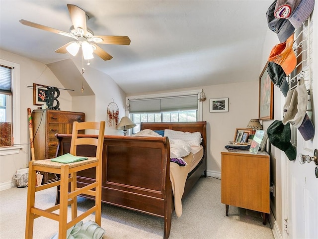 2321 Cashion Pl, Oklahoma City, OK 73112 - bedroom with multiple windows, light carpet, baseboards, vaulted ceiling, and ceiling fan