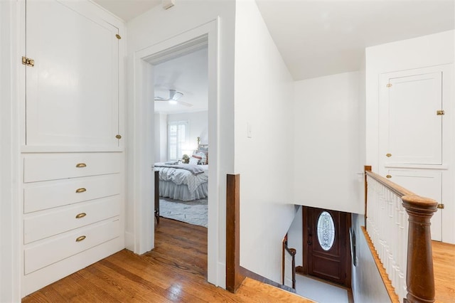 entryway with wood finished floors