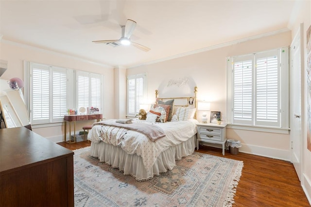 bedroom with baseboards, ornamental molding, wood finished floors, and ceiling fan