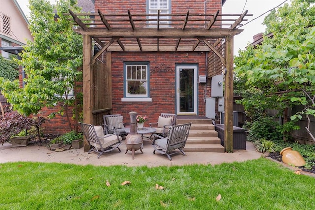 rear view of house featuring brick siding, a pergola, an outdoor hangout area, and a patio area