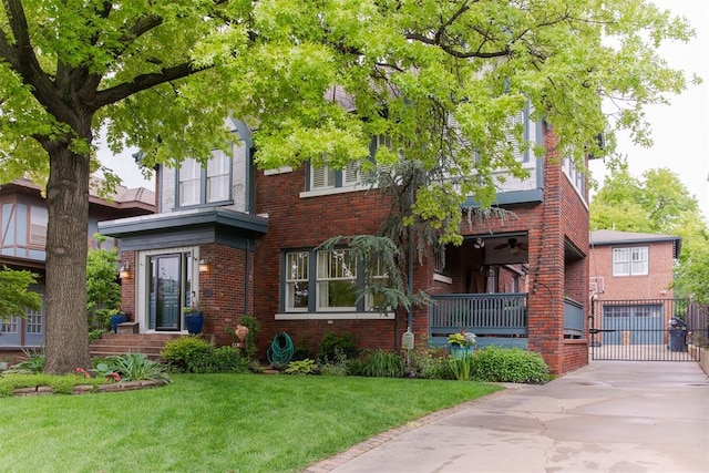 view of front facade featuring brick siding, a front yard, concrete driveway, and a garage
