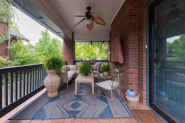 balcony with a ceiling fan and an outdoor living space