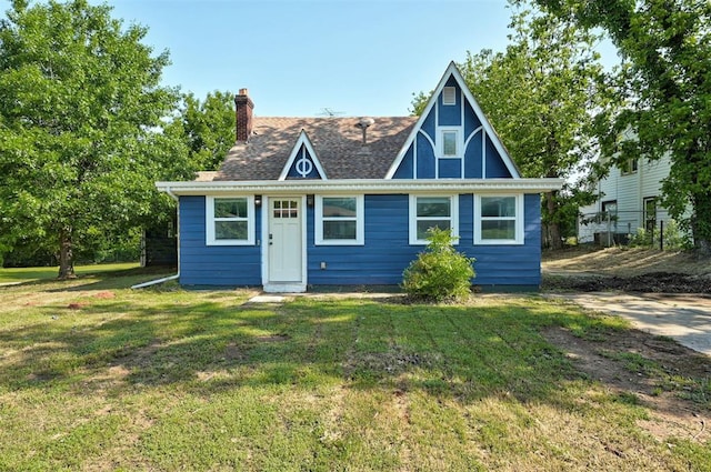 1706 E Oklahoma Ave, Guthrie, OK 73044 - english style home with a chimney and a front lawn