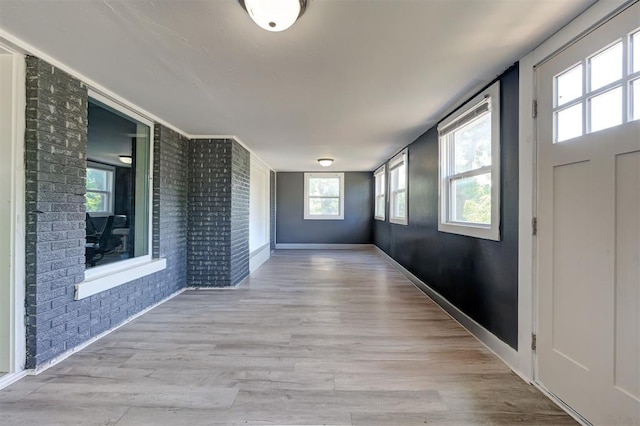1706 E Oklahoma Ave, Guthrie, OK 73044 - foyer entrance with brick wall and wood finished floors