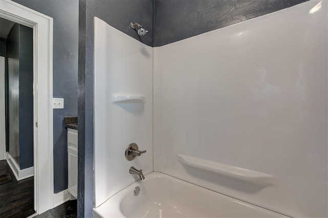 1706 E Oklahoma Ave, Guthrie, OK 73044 - bathroom with bathtub / shower combination, baseboards, and vanity