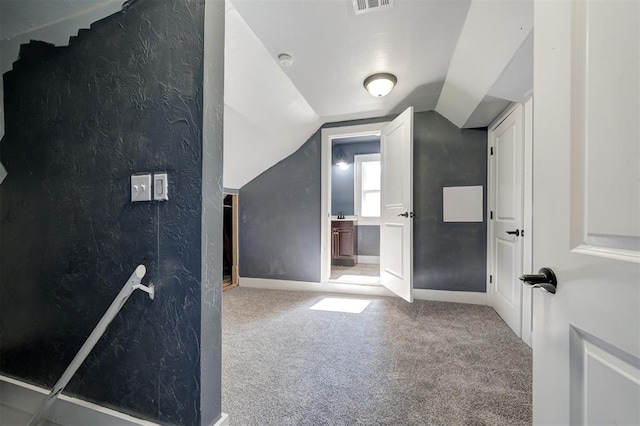1706 E Oklahoma Ave, Guthrie, OK 73044 - additional living space with carpet flooring, lofted ceiling, and baseboards