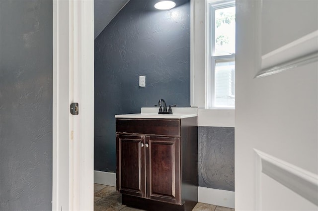 1706 E Oklahoma Ave, Guthrie, OK 73044 - bathroom featuring vanity and a textured wall