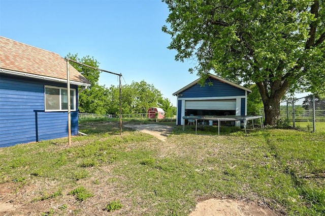 1706 E Oklahoma Ave, Guthrie, OK 73044 - view of yard featuring a garage and an outbuilding