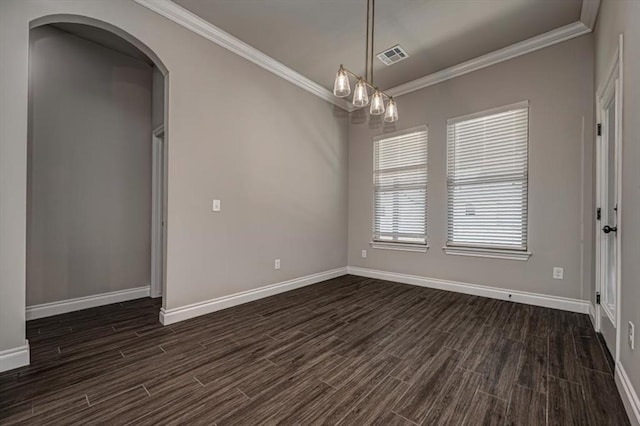 unfurnished room with ornamental molding, dark wood-type flooring, baseboards, and arched walkways