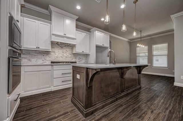 kitchen with wall oven, dark wood finished floors, decorative backsplash, white cabinets, and light countertops