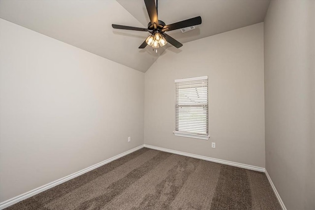 spare room with a ceiling fan, baseboards, lofted ceiling, and dark colored carpet