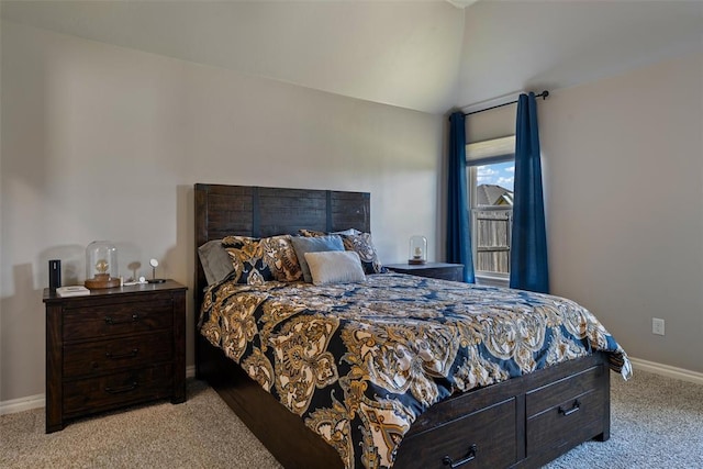 bedroom with carpet flooring, baseboards, and lofted ceiling