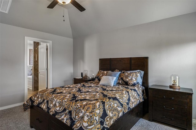 carpeted bedroom featuring lofted ceiling, baseboards, a ceiling fan, and connected bathroom