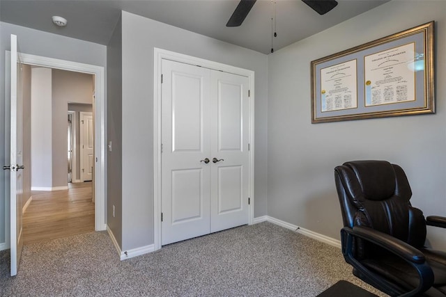 office area featuring baseboards, carpet floors, and ceiling fan