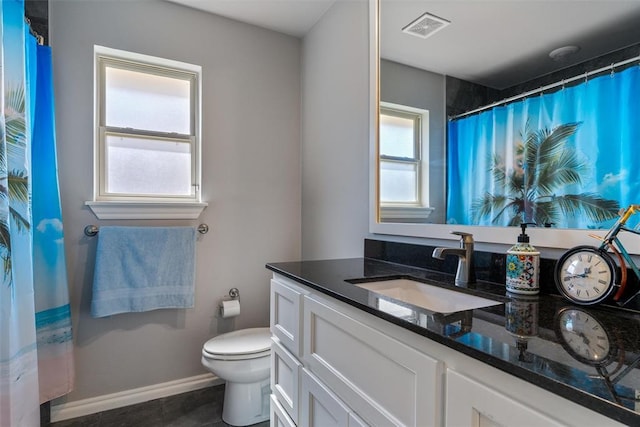 bathroom featuring vanity, toilet, baseboards, and a shower with curtain