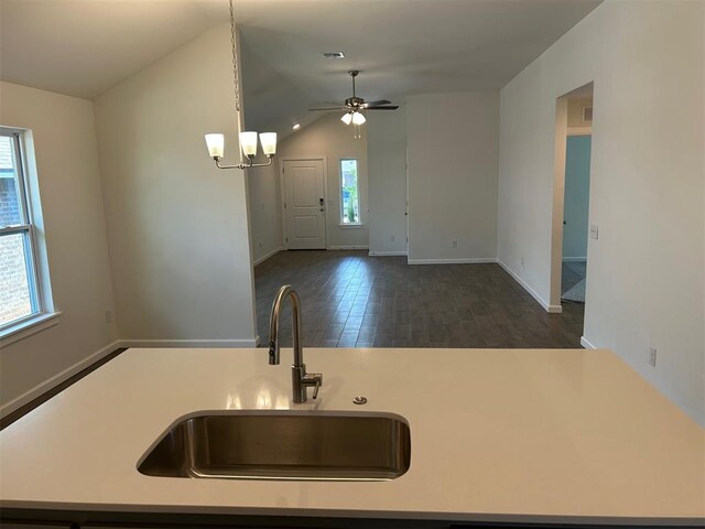 2933 NW 196th Pl, Edmond, OK 73012 - kitchen with a sink, light countertops, a ceiling fan, vaulted ceiling, and baseboards