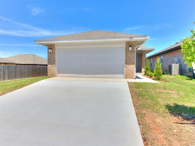 9231 SW 47th St, Oklahoma City, OK 73179 - single story home featuring brick siding, a garage, and cooling unit