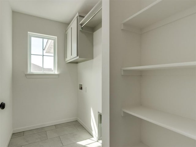 959 SE 16th Ter, Newcastle, OK 73065 - washroom featuring baseboards, hookup for a washing machine, light tile patterned floors, and cabinet space