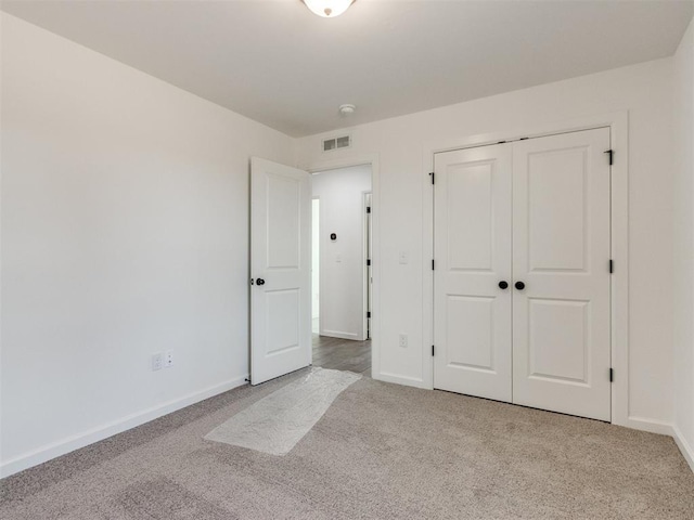 959 SE 16th Ter, Newcastle, OK 73065 - unfurnished bedroom featuring carpet flooring, baseboards, and a closet