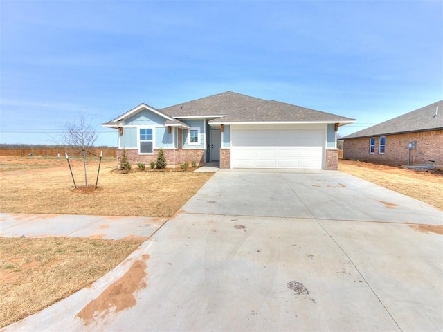 959 SE 16th Ter, Newcastle, OK 73065 - ranch-style home with brick siding, a garage, driveway, and a front lawn