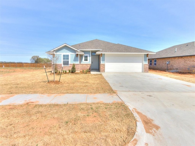 959 SE 16th Ter, Newcastle, OK 73065 - single story home with an attached garage, driveway, brick siding, and a front lawn