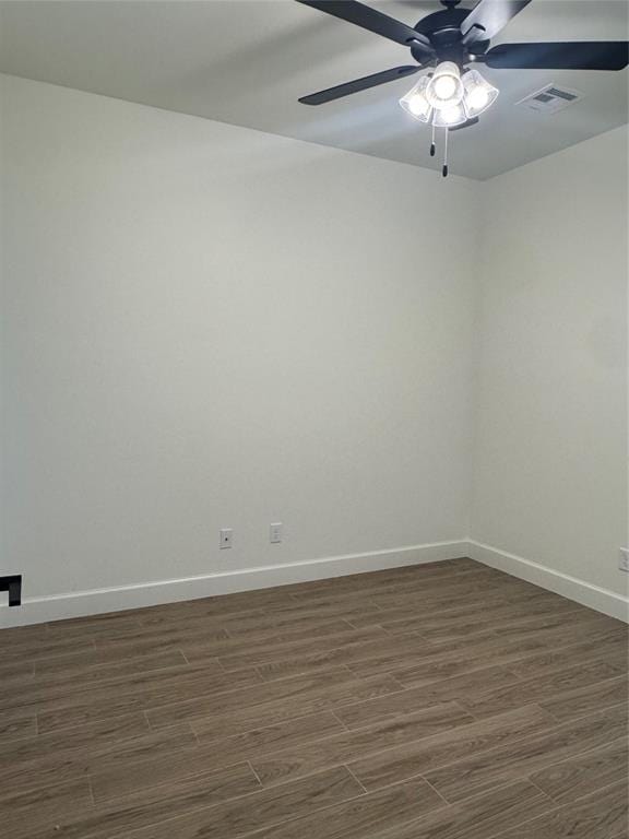 9596 Regado Ct, Guthrie, OK 73044 - empty room with dark wood-type flooring, baseboards, and ceiling fan