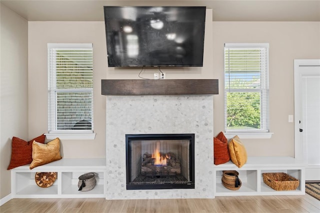 2803 Redwood Ct, Newcastle, OK 73065 - detailed view of wood finished floors and a warm lit fireplace