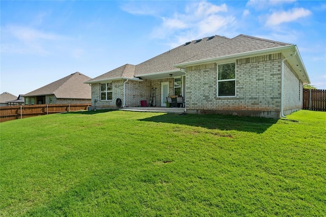 2803 Redwood Ct, Newcastle, OK 73065 - back of house with a patio, roof with shingles, and brick siding