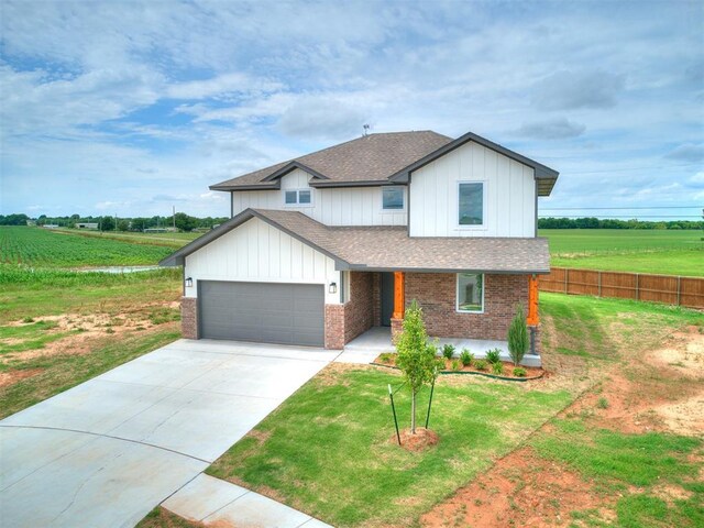 929 SE 16th Ter, Newcastle, OK 73065 - modern farmhouse style home with a shingled roof, brick siding, a view of rural / pastoral area, and a garage