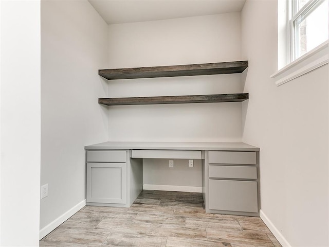 929 SE 16th Ter, Newcastle, OK 73065 - unfurnished office with built in study area, light wood finished floors, and baseboards