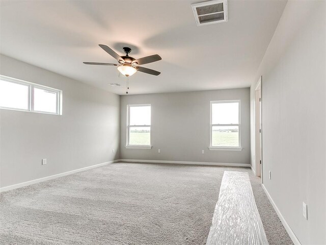 929 SE 16th Ter, Newcastle, OK 73065 - unfurnished room featuring healthy amount of natural light, carpet, and ceiling fan