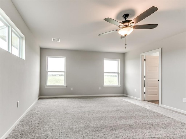 929 SE 16th Ter, Newcastle, OK 73065 - spare room with plenty of natural light, a ceiling fan, carpet, and baseboards