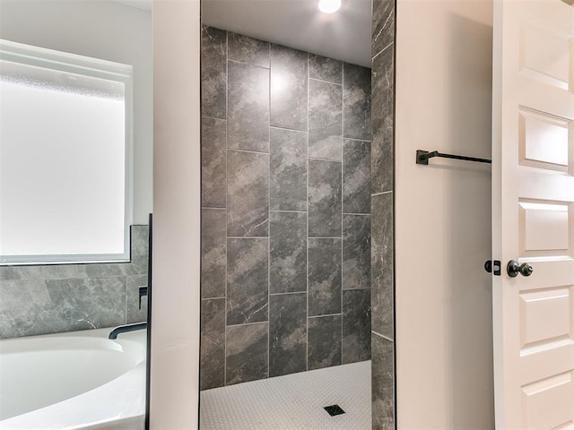 929 SE 16th Ter, Newcastle, OK 73065 - bathroom featuring a bath and a tile shower
